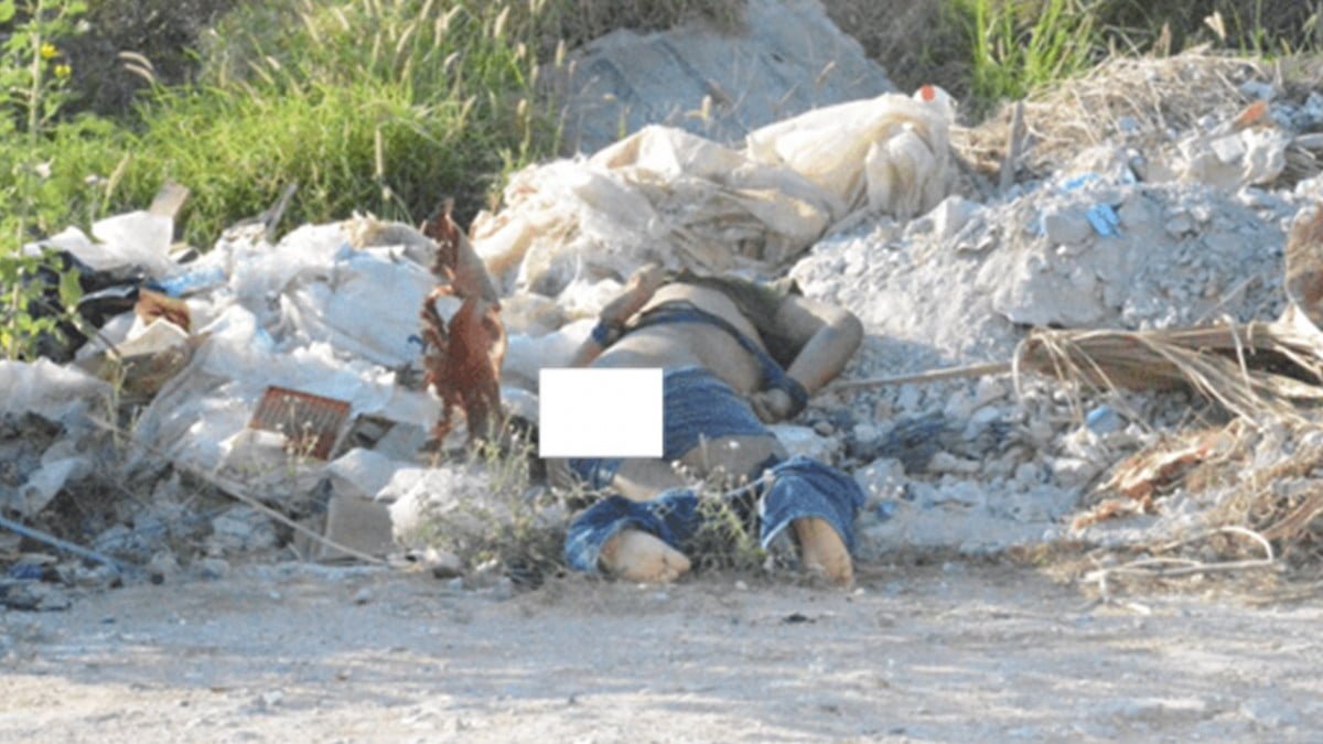 Encuentran persona del sexo masculino atado y ejecutado entre la basura